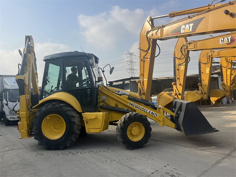 Kullanılmış New Holland LB95B-4PT 4'te 1 çok amaçlı kova, pilot kontrolü ve ROPS / FOPS kapalı kabinli backhoe yükleyicisi