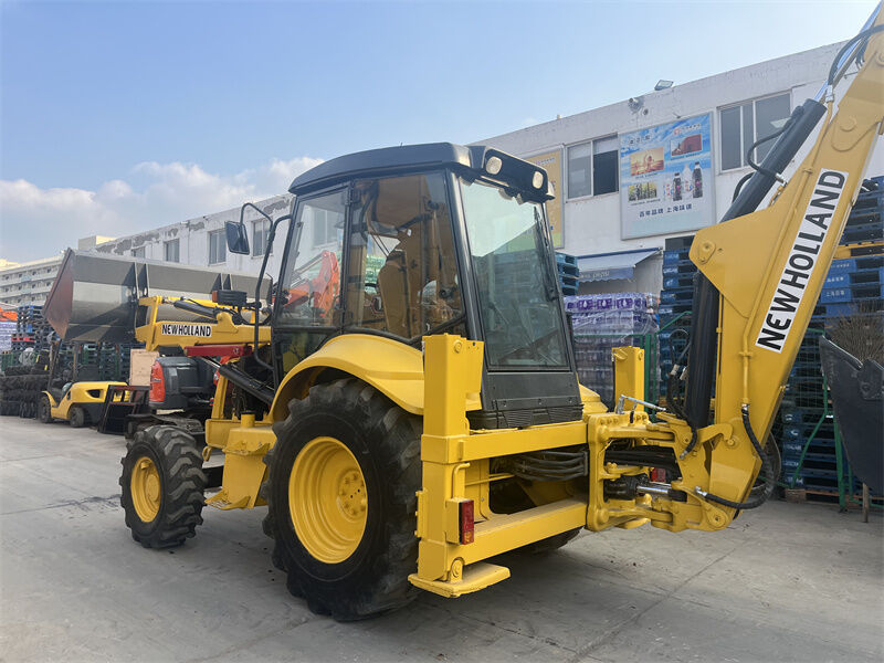 Kullanılmış New Holland LB95B-4PT 4'te 1 çok amaçlı kova, pilot kontrolü ve ROPS / FOPS kapalı kabinli backhoe yükleyicisi